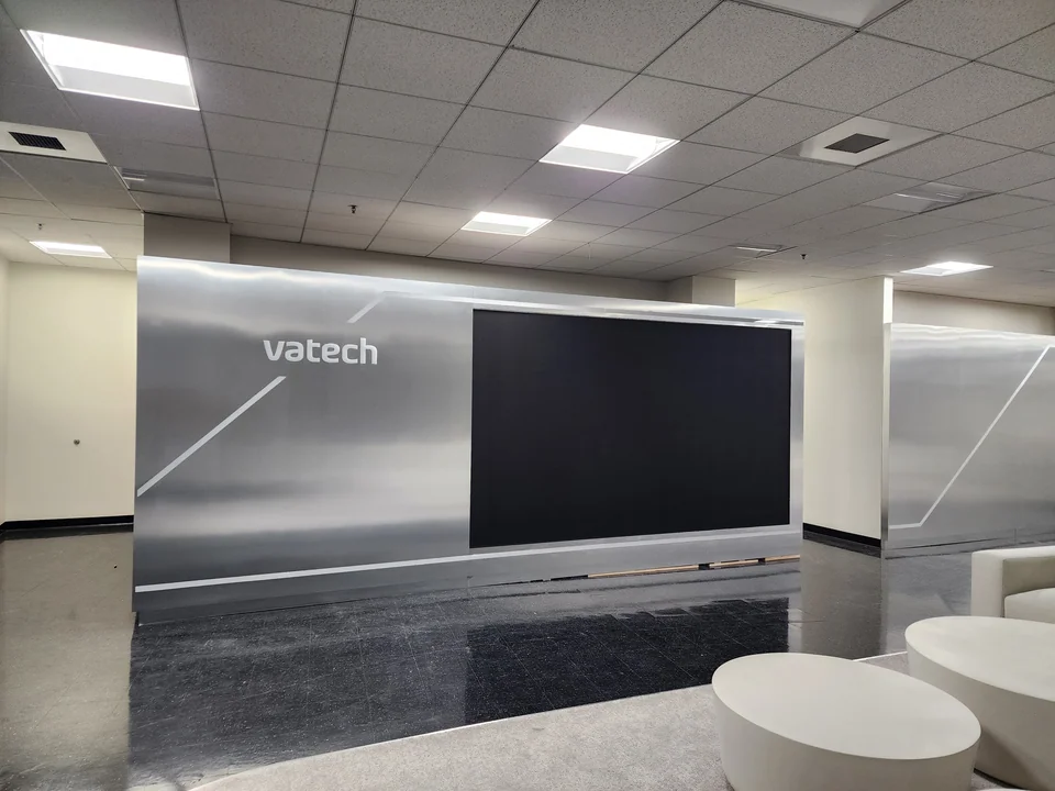The completed display wall beside the lounge seating.