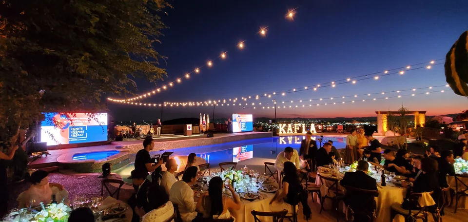 A wide evening view of the event setting.