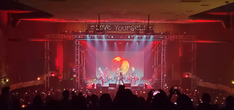 An audience view of the concert in the tiered venue.