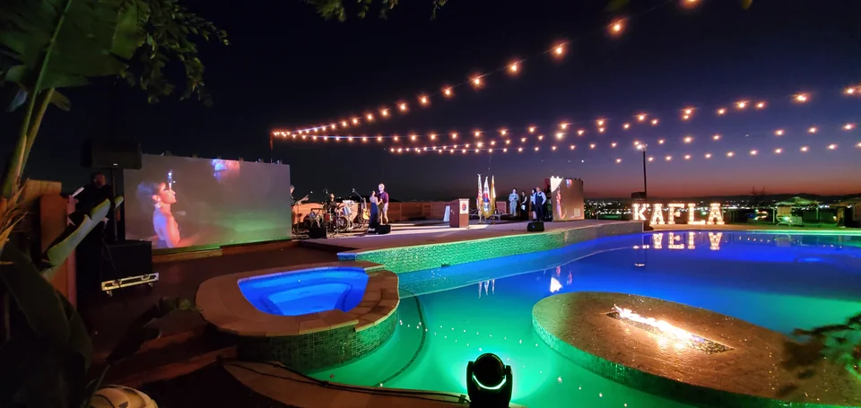 The display pair seen across the illuminated pool.